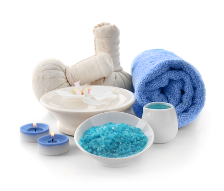 Beautiful spa composition with sea salt and herbal bags on white backgroundの写真素材