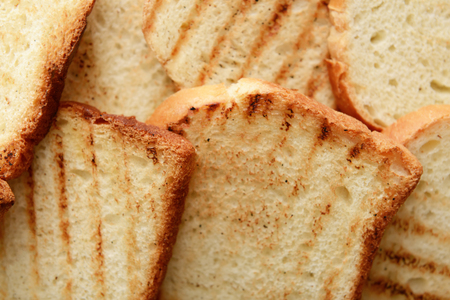 Tasty toasted bread as background, closeupの写真素材