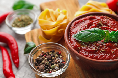 Bowl with spicy tomato sauce on table, closeupの写真素材