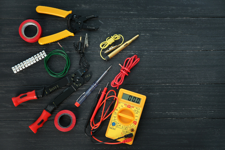 Flat lay composition with electrical tools on wooden backgroundの写真素材