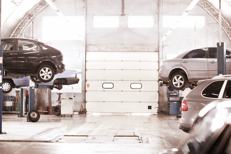 Interior of car service center with automobilesの写真素材