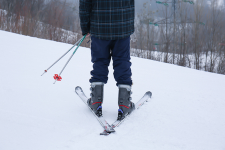 Male skier on slope at winter resortの写真素材