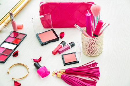 Set of cosmetic products and brushes on tableの写真素材