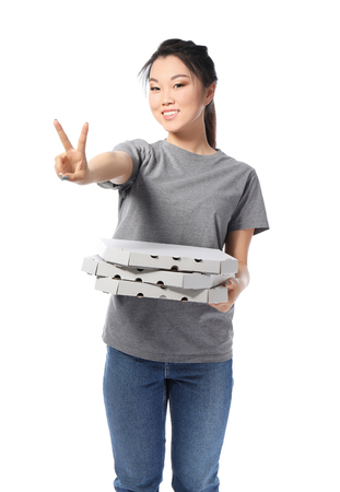 Asian woman with cardboard pizza boxes on white background. Food delivery serviceの写真素材