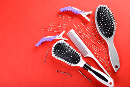 Flat lay composition with set of hairdresser's tools on color backgroundの写真素材