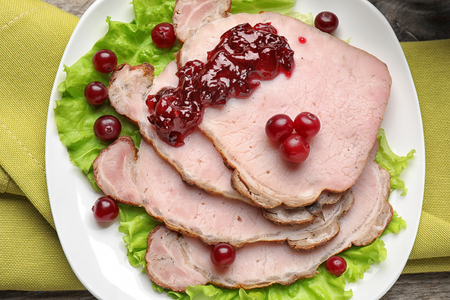 Tasty dish served with cranberry sauce on plate, top viewの写真素材