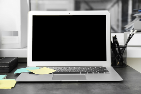 Stylish workplace with laptop on tableの写真素材