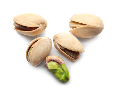 Tasty pistachio nuts on white backgroundの写真素材