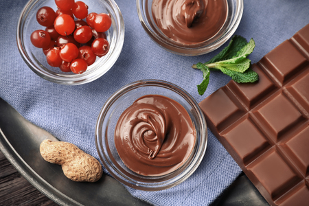 Composition with tasty melted chocolate on table, top viewの写真素材