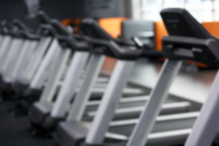Blurred view of gym interior with modern equipmentの写真素材