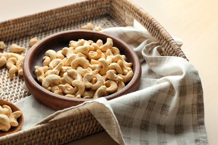 Composition with tasty cashew nuts on wooden tableの写真素材