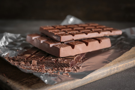 Delicious chocolate bars on foil