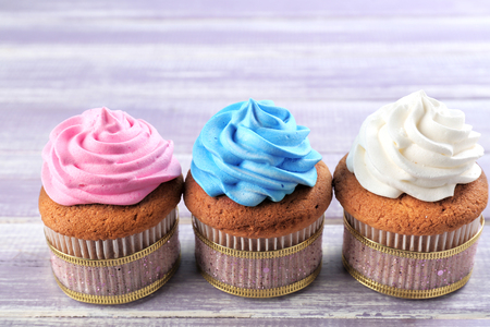 Tasty cupcakes on wooden background. Mother's Day celebrationの写真素材