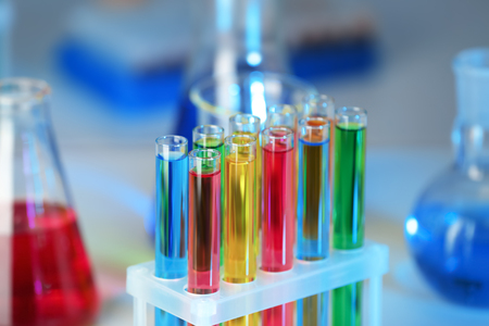 Test tubes with colorful liquids in rack, closeupの写真素材