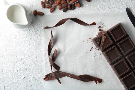 Composition with delicious chocolate and shavings on tableの写真素材