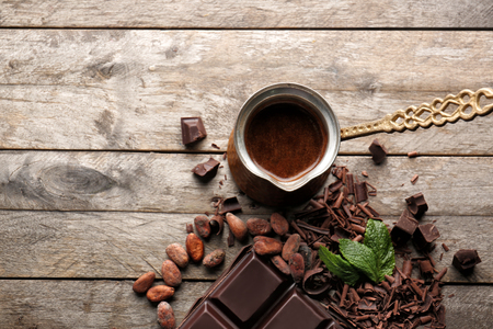 Composition with chocolate and coffee on wooden tableの写真素材