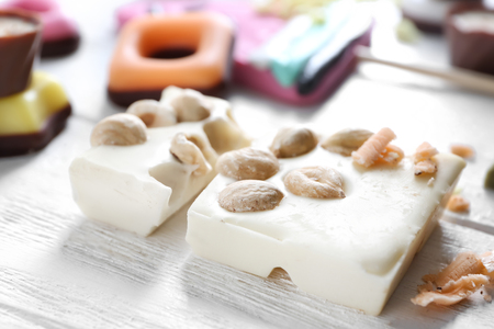 Pieces of white chocolate on wooden tableの写真素材