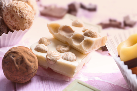 Delicious chocolate candies on wooden tableの写真素材