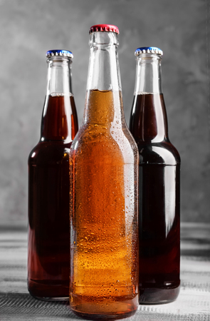Fresh beer in glass bottles on tableの写真素材