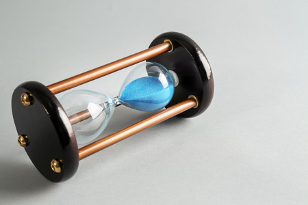 Hourglass on light background. Time management concept