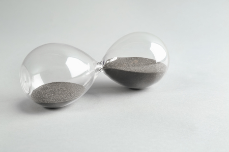 Hourglass on light background. Time management concept