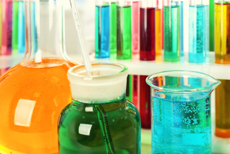 Beaker, flasks and test tubes with colorful liquids, closeupの写真素材