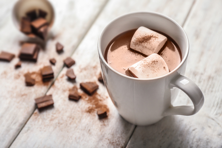 Cup of hot chocolate with marshmallow on wooden tableの写真素材