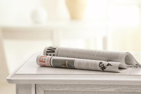 Morning newspapers on white tableの写真素材