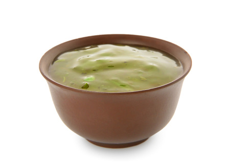 Bowl with pesto sauce on white backgroundの写真素材