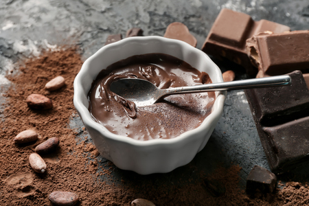 Bowl with molten chocolate on tableの写真素材