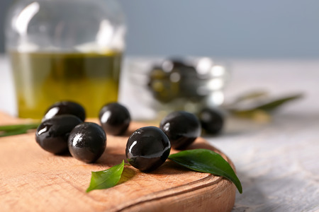 Black canned olives on table, closeupの写真素材