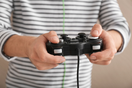 Young man with gamepad, closeup