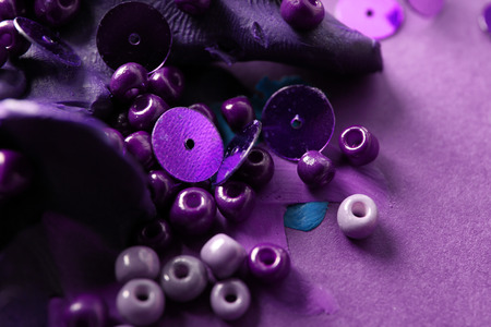 Sequins and beads with playdough on color backgroundの写真素材