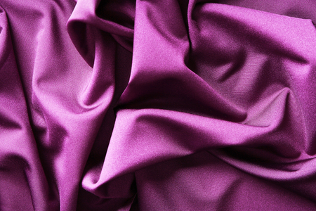 Purple fabric with folds, closeupの写真素材