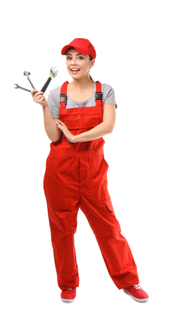 Female car mechanic with tools on white backgroundの写真素材
