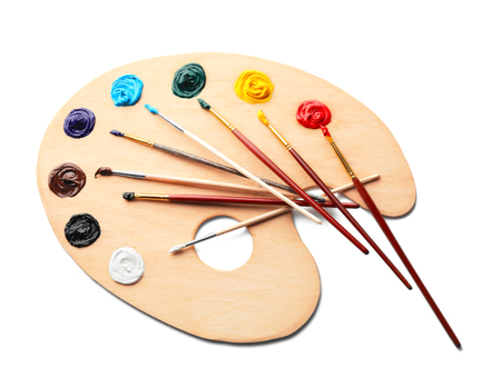 Paint palette with brushes on white backgroundの写真素材