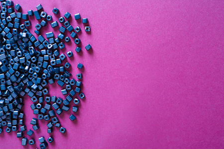 Many purple beads on color background