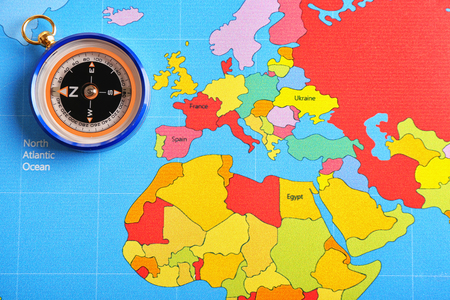 Compass on world map