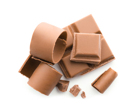 Pieces of chocolate and curls on white backgroundの写真素材