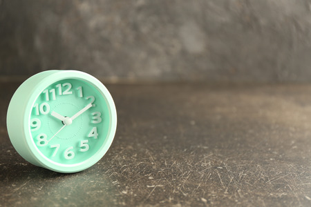 Alarm clock on grey background. Time management concept