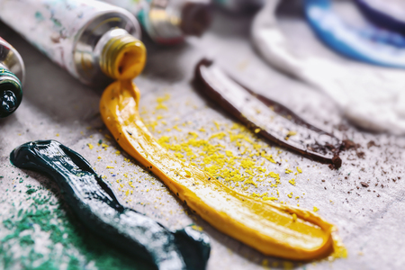 Oil paints on table, closeupの写真素材