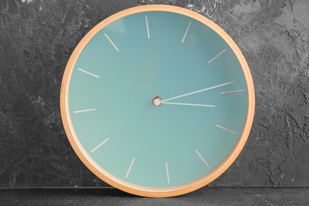Clock on grey background. Time management concept