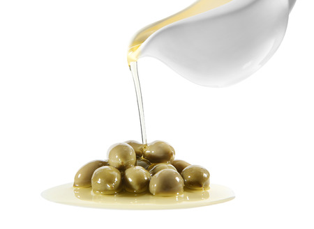 Pouring of oil onto canned olives on white backgroundの写真素材