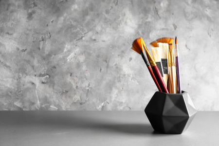 Many paint brushes on grey backgroundの写真素材