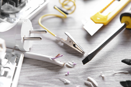 Different electrician's supplies on table