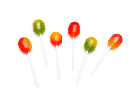 Tasty colorful lollipops on white backgroundの写真素材