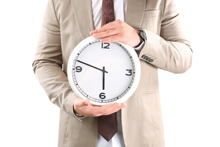Man holding clock on white background. Time management conceptの写真素材