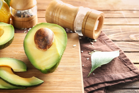 Fresh sliced avocado on cutting boardの写真素材