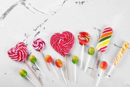 Different candies on color background, top viewの写真素材