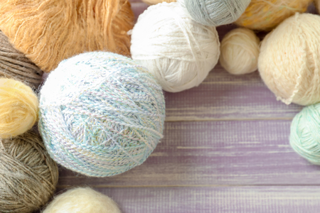 Set of knitting yarn on wooden backgroundの写真素材